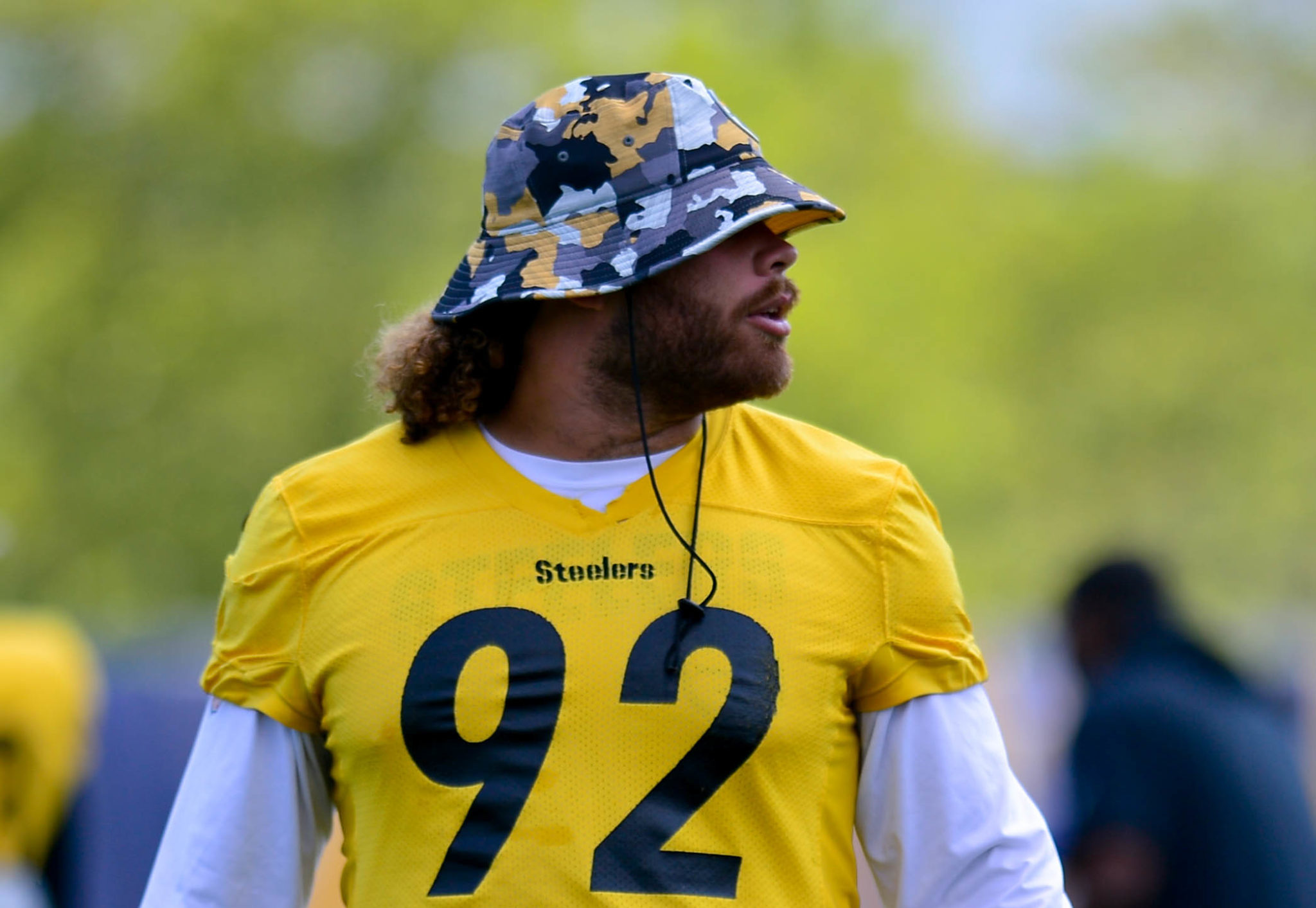 Steelers players wearing caps at training camp