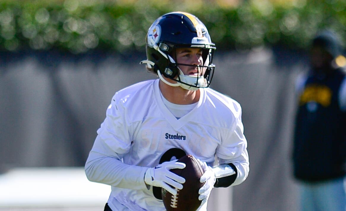 Pittsburgh Steelers quarterback Kenny Pickett, right, talks with